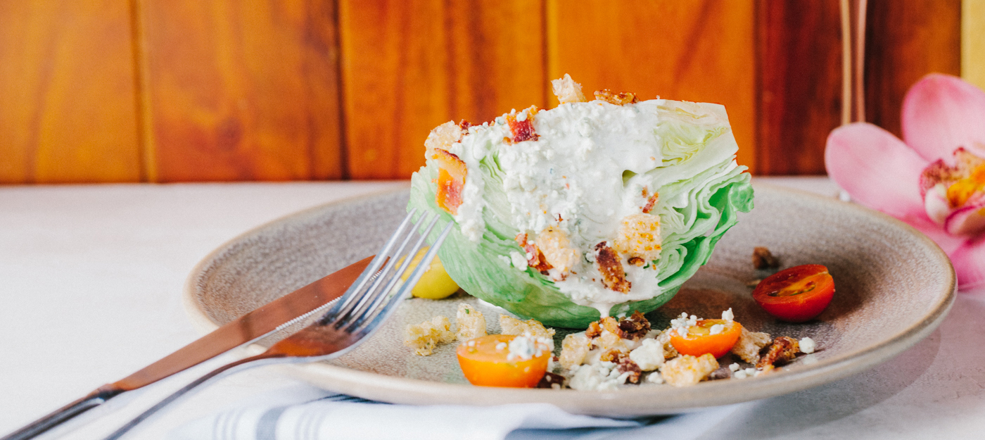 One quarter of a head of lettuce salad with cheese and tomatoes