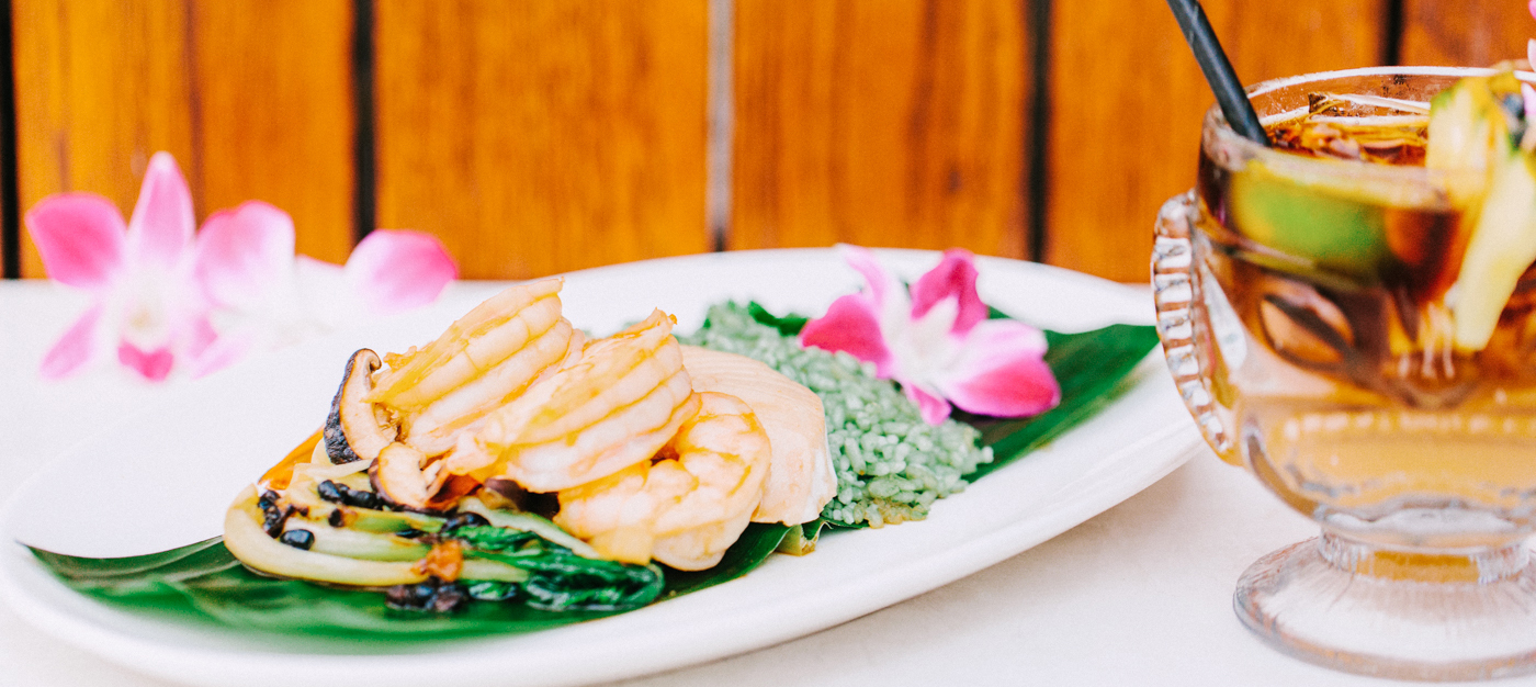 Shrimp dish with tropical cocktail